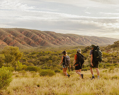 Photo of three backpackers in the outback.